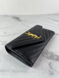 SAINT LAURENT BLACK CASSANDRE MATELASSÉ LARGE FLAP WALLET IN GRAIN DE POUDRE LEATHER