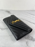 SAINT LAURENT BLACK CASSANDRE MATELASSÉ LARGE FLAP WALLET IN GRAIN DE POUDRE LEATHER