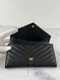 SAINT LAURENT BLACK CASSANDRE MATELASSÉ LARGE FLAP WALLET IN GRAIN DE POUDRE LEATHER