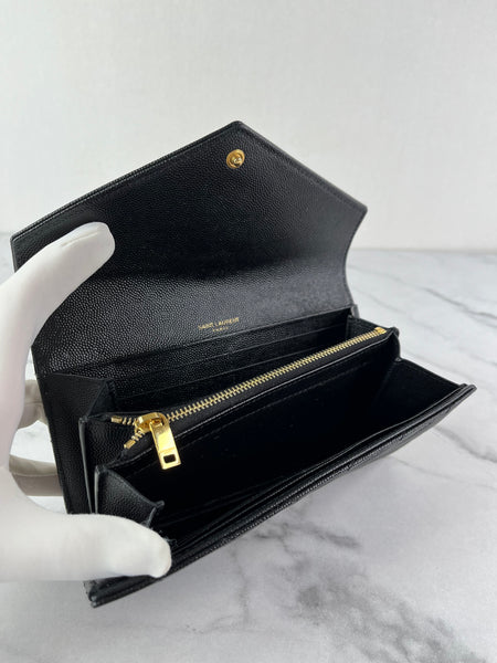 SAINT LAURENT BLACK CASSANDRE MATELASSÉ LARGE FLAP WALLET IN GRAIN DE POUDRE LEATHER