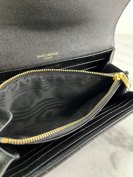 SAINT LAURENT BLACK CASSANDRE MATELASSÉ LARGE FLAP WALLET IN GRAIN DE POUDRE LEATHER