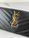 SAINT LAURENT BLACK CASSANDRE MATELASSÉ LARGE FLAP WALLET IN GRAIN DE POUDRE LEATHER