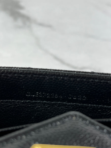 SAINT LAURENT BLACK CASSANDRE MATELASSÉ LARGE FLAP WALLET IN GRAIN DE POUDRE LEATHER