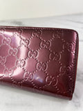 GUCCI Guccissima Metallic Burgundy Patent Zip Around Long Wallet