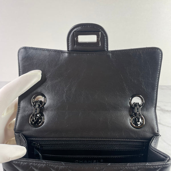 CHANEL So Black Aged Calfskin Chevron Quilted 2.55 Reissue Mini Flap Bag