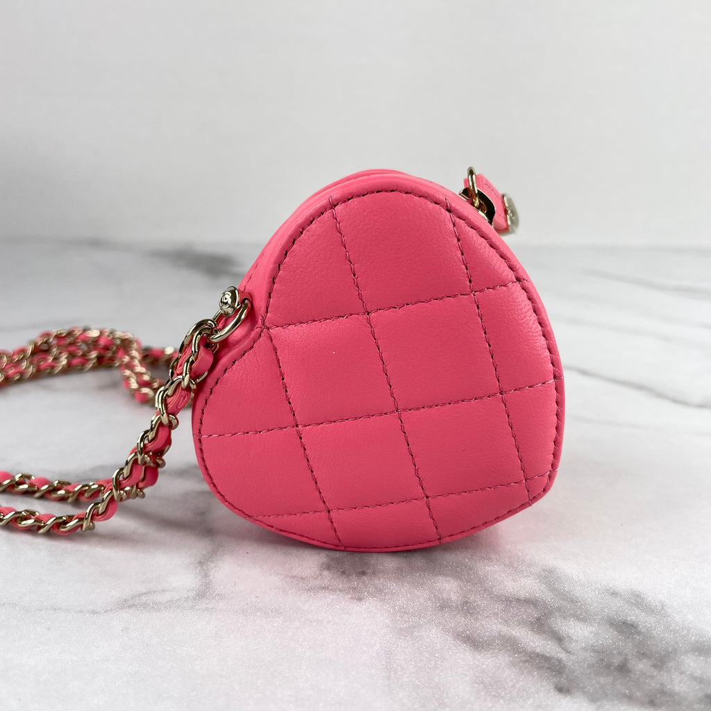 chanel bag with heart chain necklace